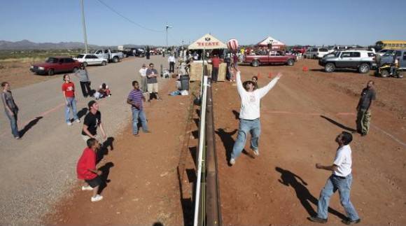 Americans and Mexicans playing volleyball over the border in Arizona