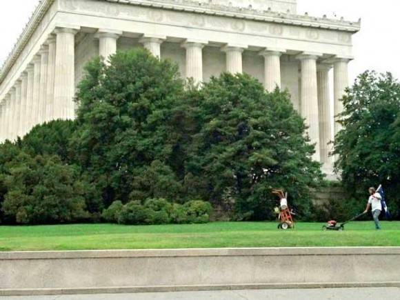 This guy is mowing the grass at the Lincoln Memorial right now. Someone give him a medal.