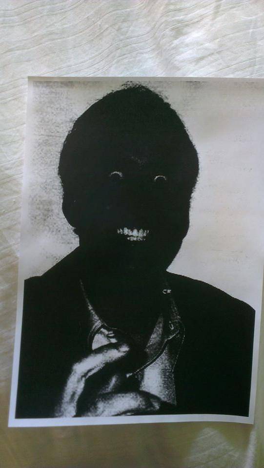 A friend's printer broke, here's the result of him printing off a picture of Nicolas Cage.