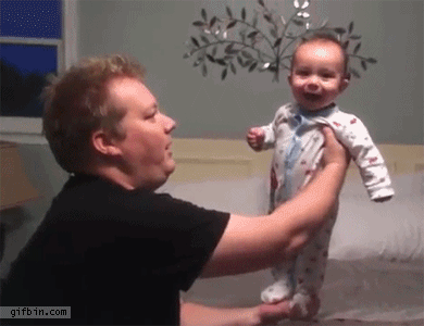 Balancing laughing baby