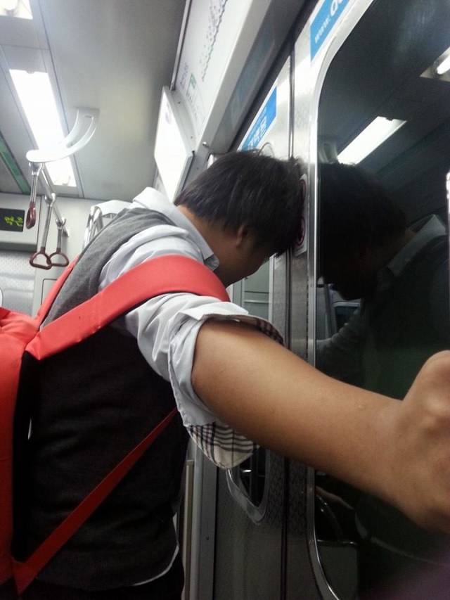 On the subway back home, a student was fooling around with the door. He was stuck like this until the next stop. We all had a good laugh.