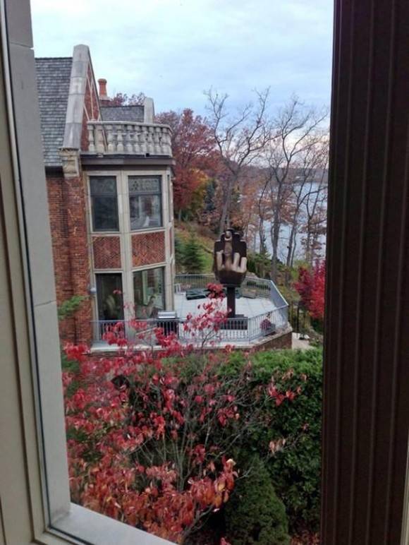Bitter man buys the house next door to his ex-wife and installs an interesting sculpture.
