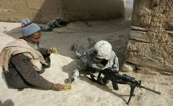 A local offering tea to a soldier, I salute this guys kindness