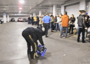 Guy breaks new PS4 in front of people standing in line to buy one
