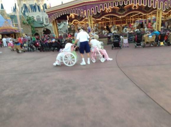 Very old man pushing his disabled daughter and pulling his wife. Now that’s dedication