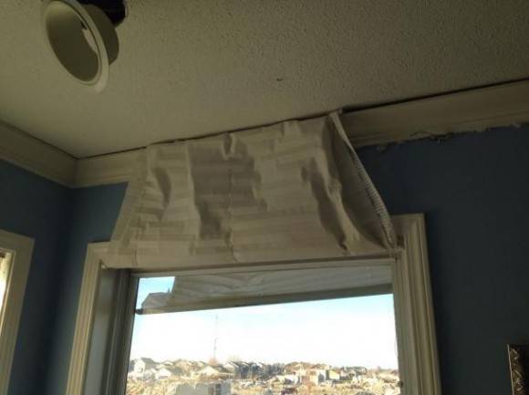 Tornado blew the roof up, the curtain blew outside, then the roof came back down, trapping the curtain