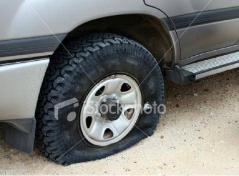 My employee told me that he couldn't get to work because he had a flat tire. This is the picture he texted me.
