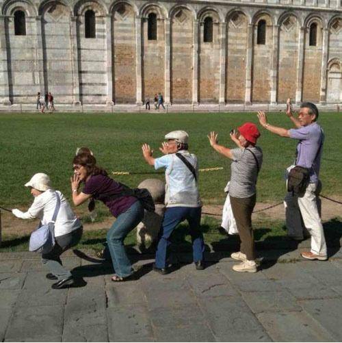 Tourists at the Leaning Tower of Pisa.