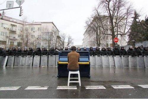 Take this piano music you mofo riot police