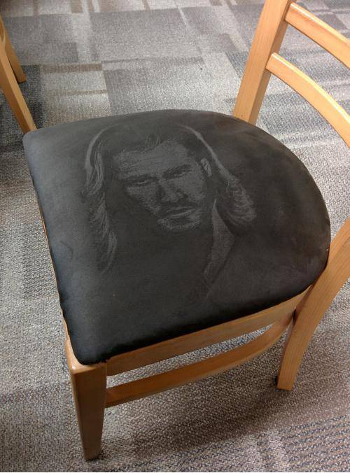 Someone drew Thor on a suede chair
