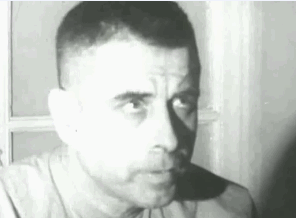 POW blinking in morse code to spell T-O-R-T-U-R-E during a forced interview.