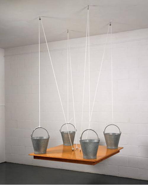 Table held up by buckets resting on it