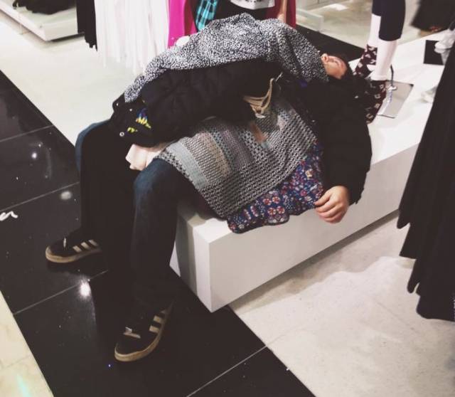 Poor guy was shopping with three girls (family from the looks of it). He laid down for a second and they just left him like this. They shopped, he dropped.