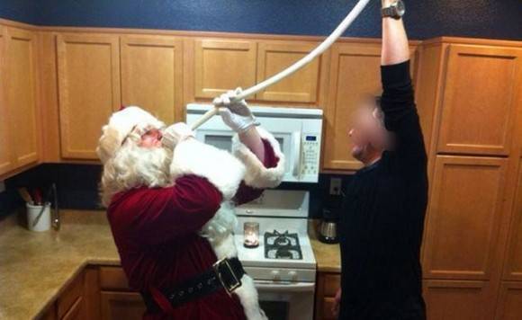 Santa hosing down a root beer