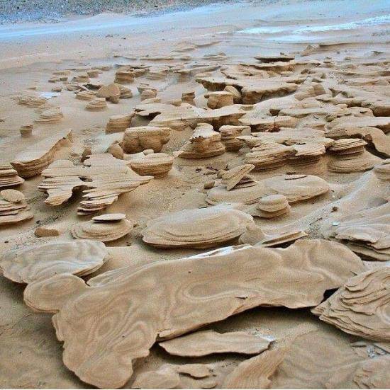 Incredible frozen sand formations forming along Lake Michigan