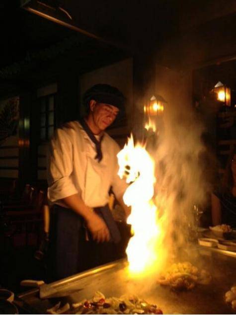 A dragon rises from the flames.