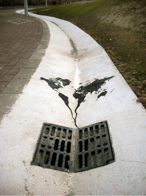 World going down the drain street art
