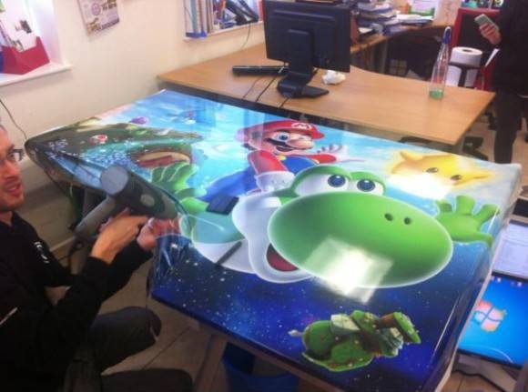 I work for a vinyl graphics company, did this to my desk today.