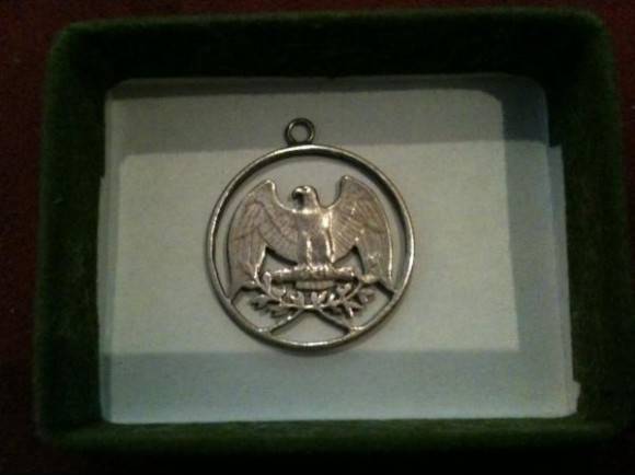 My great-grandfather made this from an American quarter.