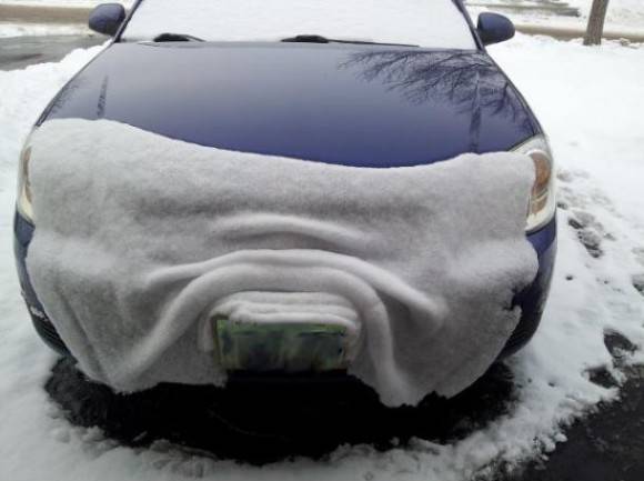 Snow on my friends hood, sliding off like a blanket