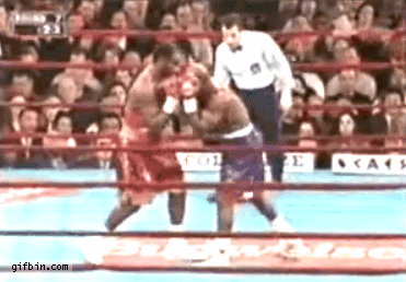 Boxing referee dodges punch