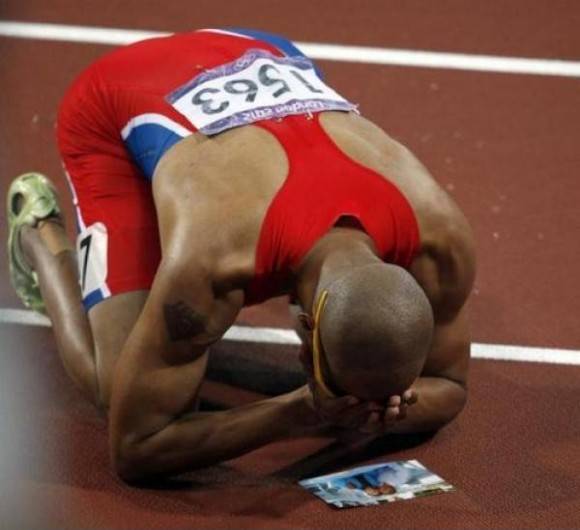 At the Beijing Olympics Felix Sanchez got the news that his grandma had died. He ran, but ended up doing horribly. He vowed that he would win a medal for her before he retired. And in London, he won the gold. That picture on the ground is of himself and his grandma.