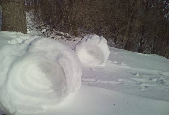 The wind is blowing so hard in Ohio that the snow is rolling itself up like this....