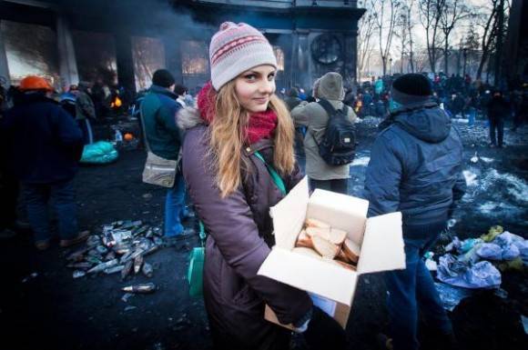 Throughout the protests, a beautiful Ukrainian girl delivers sandwiches.