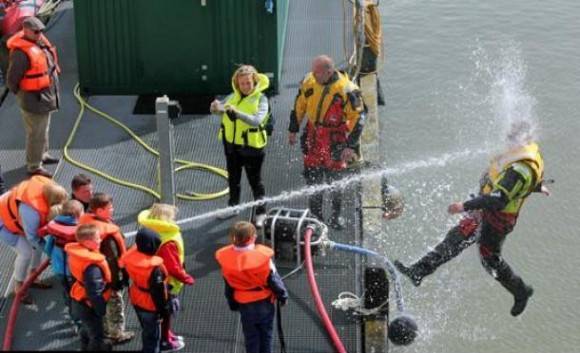 This is what happens when a kid finds a random hose at a Coast Guard demonstration