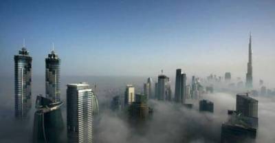 Dubai covered in fog gives its sky line an enchanting feel