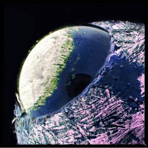 Not a planet, just the tip of a ball point pen