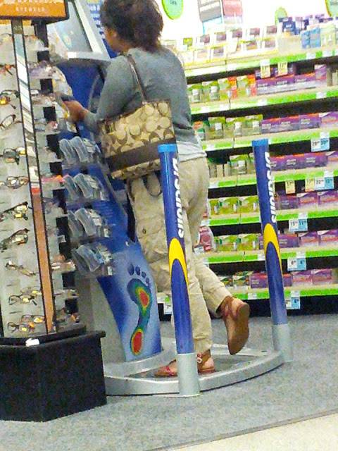 This is one of those Dr. School's kiosks that tells you what type of arch your feet have. She now thinks she is horribly flat footed.