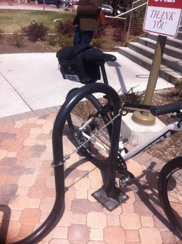 Cop at my university forgot his bicycle lock. So he improvised