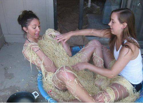 Covering up my sister with noodles. Just some spending some quality sibling time.