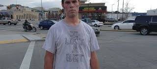 Brother loses bet and has to dance on busy intersection. People walking by join him.