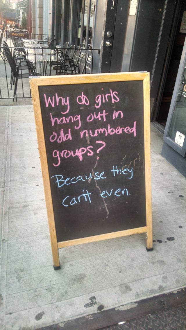 A sign outside of a bar