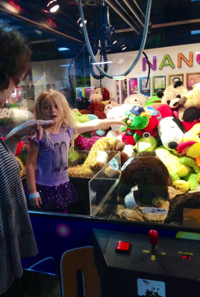 This little girl climbed into a Ft. Lauderdale claw machine today & passed out free stuffed toys to patrons unknown to arcade workers. The arcade was full of patrons who seemed to have great luck at the machine today, LoL...