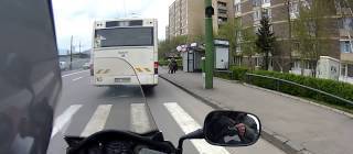 Motorcyclist helps man catch the bus