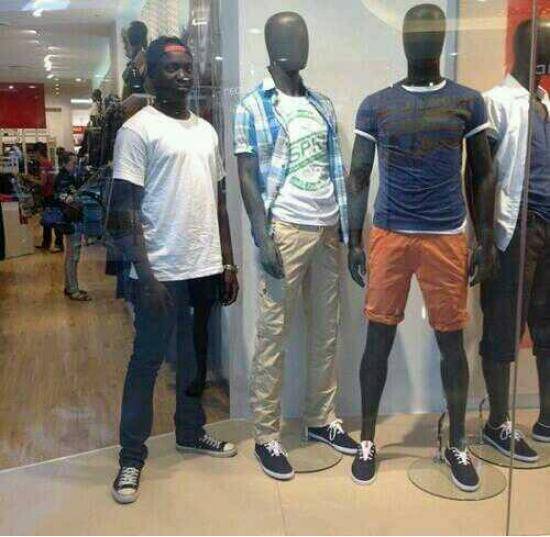 My friend decided to pose with the mannequins at the mall.