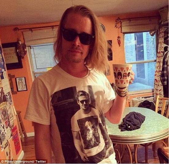 A picture of Macaulay Culkin wearing a t-shirt with a pciture Ryan Gosling wearing a t-shirt that has a picture of Macaulay Culkin