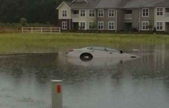 Some of the roads in my town got flooded. This guy tried to go around it. There was a ditch.