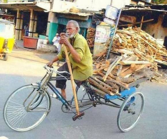 One-legged man riding a bicycle.