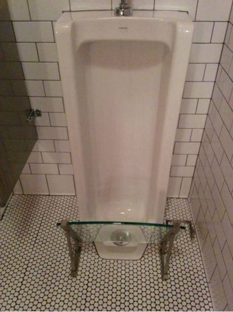 Awesome idea: This bathroom has shoe guards for the urinals