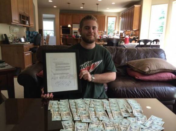 In 2001, my parents bet me that if I did not drink, smoke, or do drugs by 21, they would give me $1500. Here I am on my 21st birthday holding the contract I signed when I was 8.
