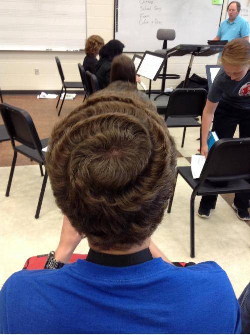 My friend’s hair naturally curls into a perfect swirl.