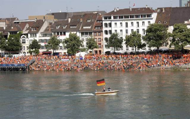 Dutch fans are watching a game against Germany on a big screen over the river. Suddenly...