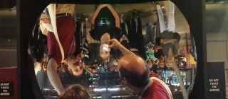 Tour guide demonstrates what you can do with a ‘real image’ on a giant concave mirror.