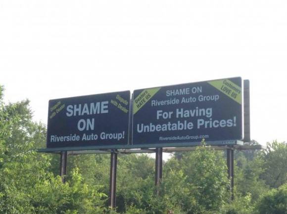 For three months now, a disgruntled customer has been paying for these deterring billboards