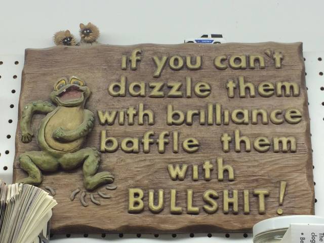 Found this sign in my grandpa's workshop. I know far too many people who live by this.