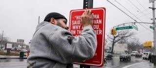 Guy goes around New York putting up signs with ‘Rap quotes’ referencing that location.